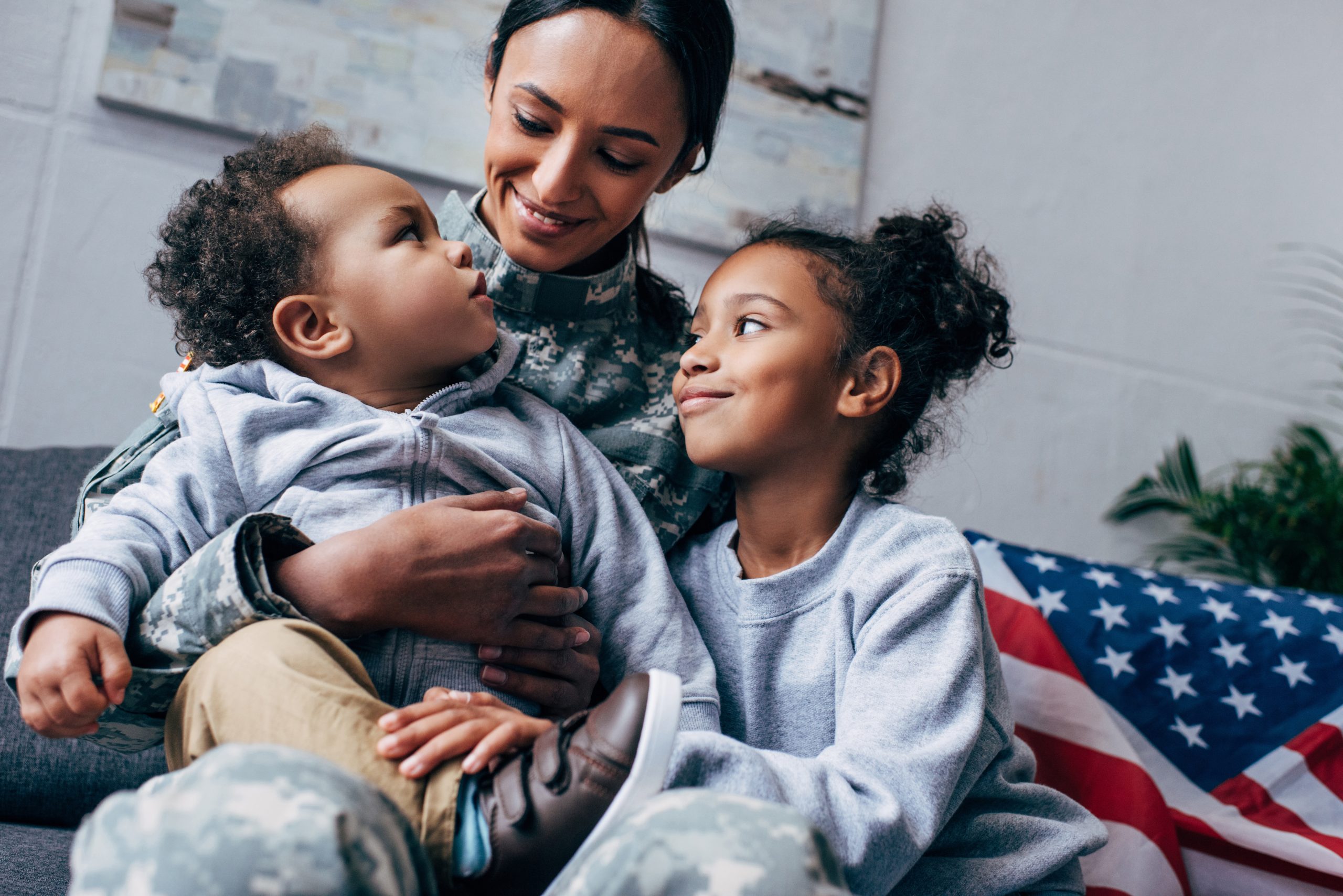 children with mother in military uniform